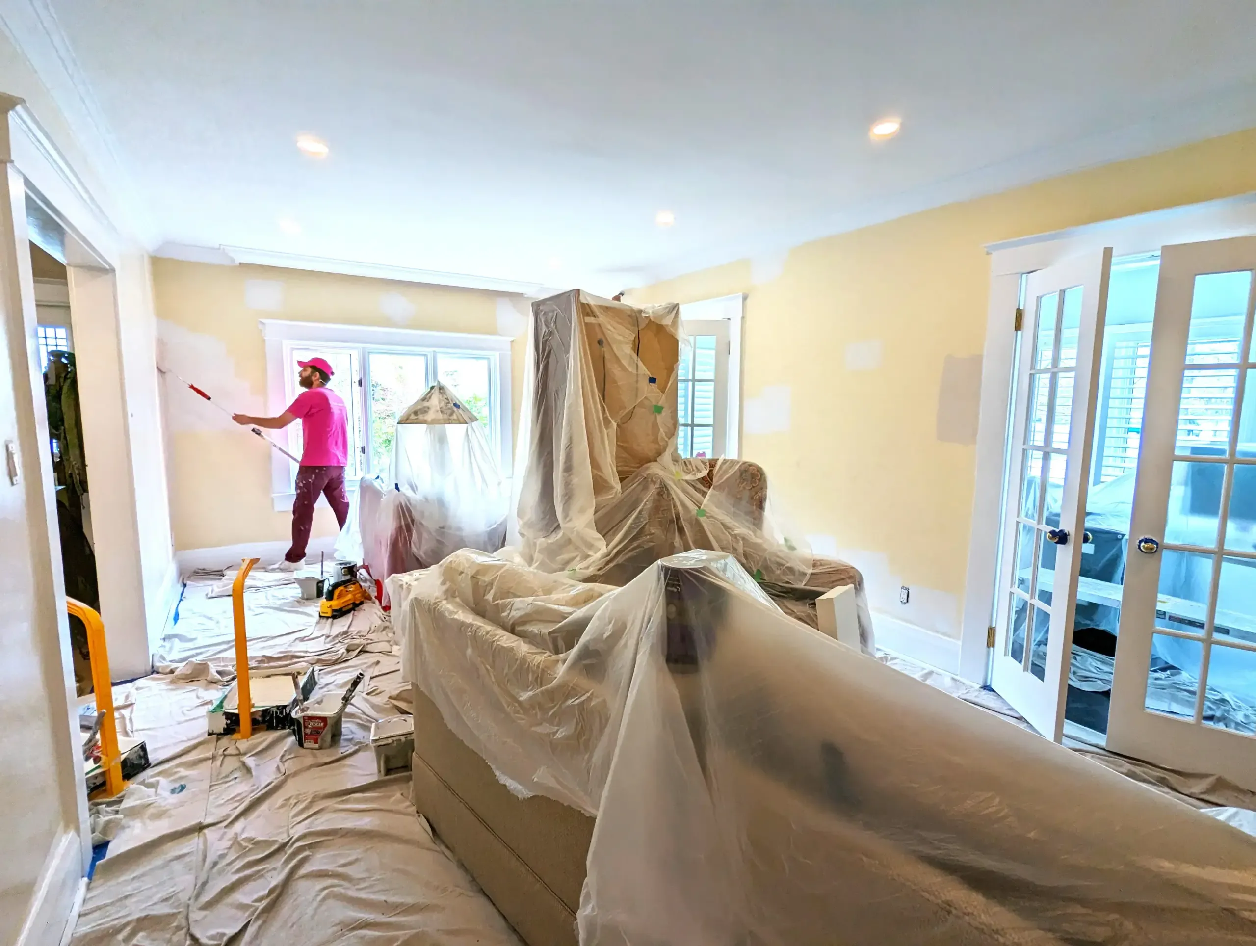 Contemporary kitchen painting Ottawa - white cabinets, marble island, professional pendant lighting